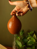 Terracotta watering bell
